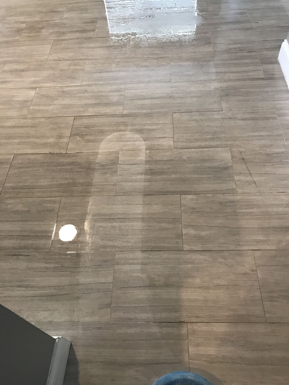 Gray plank floor shining after cleaning
