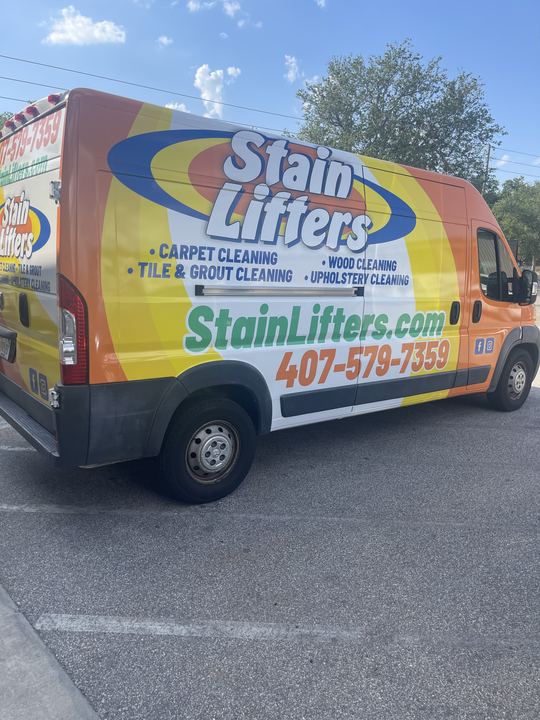 Stain Lifters work van wrapped in orange and yellow