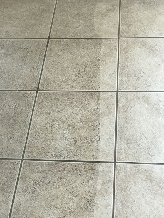 Tile and grout cleaning before and after on a beige tile floor