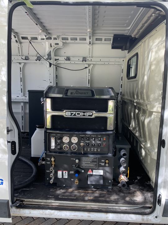 Truck-mounted extraction unit in the back of the Stain Lifters van, ready for
water removal